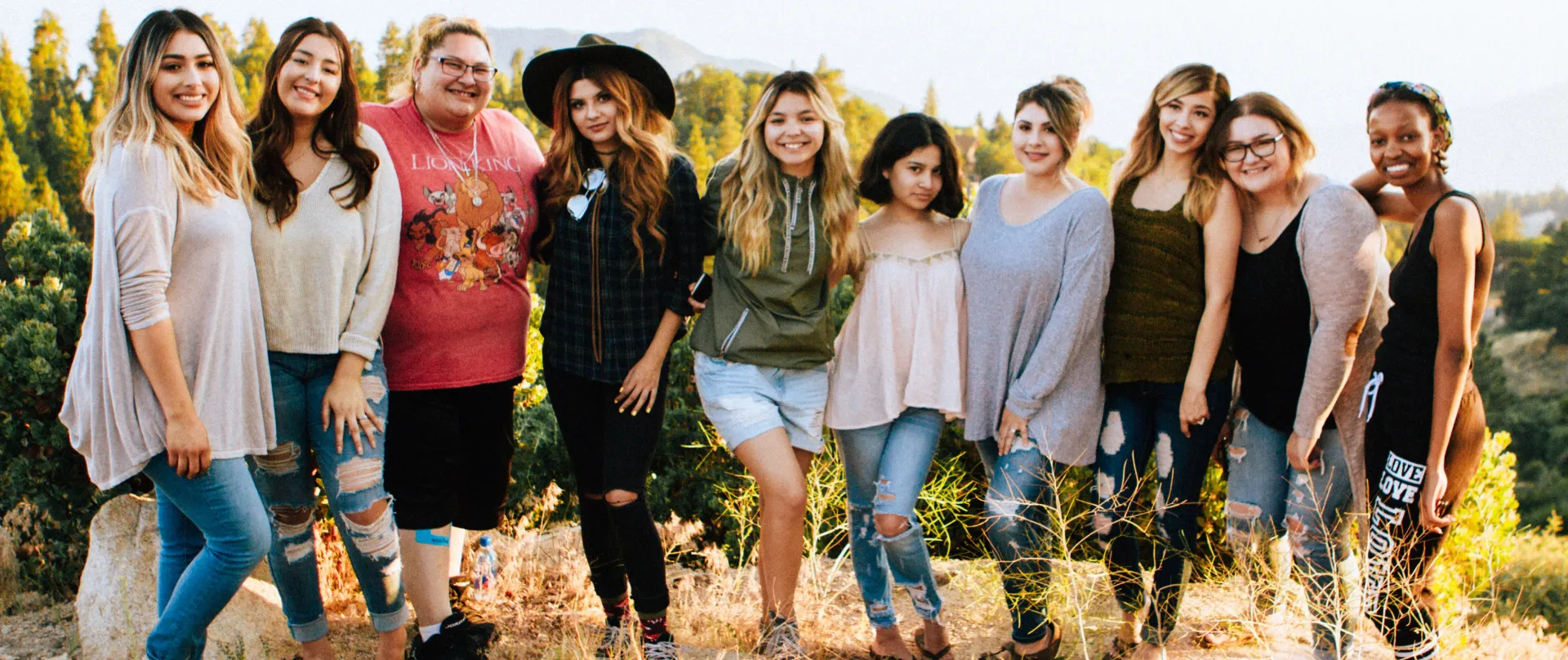 A row of young women supporting each other